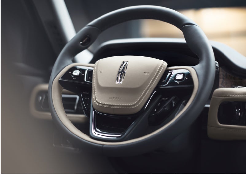 The intuitively placed controls of the steering wheel on a 2023 Lincoln Aviator® SUV | Central Florida Lincoln in Orlando FL